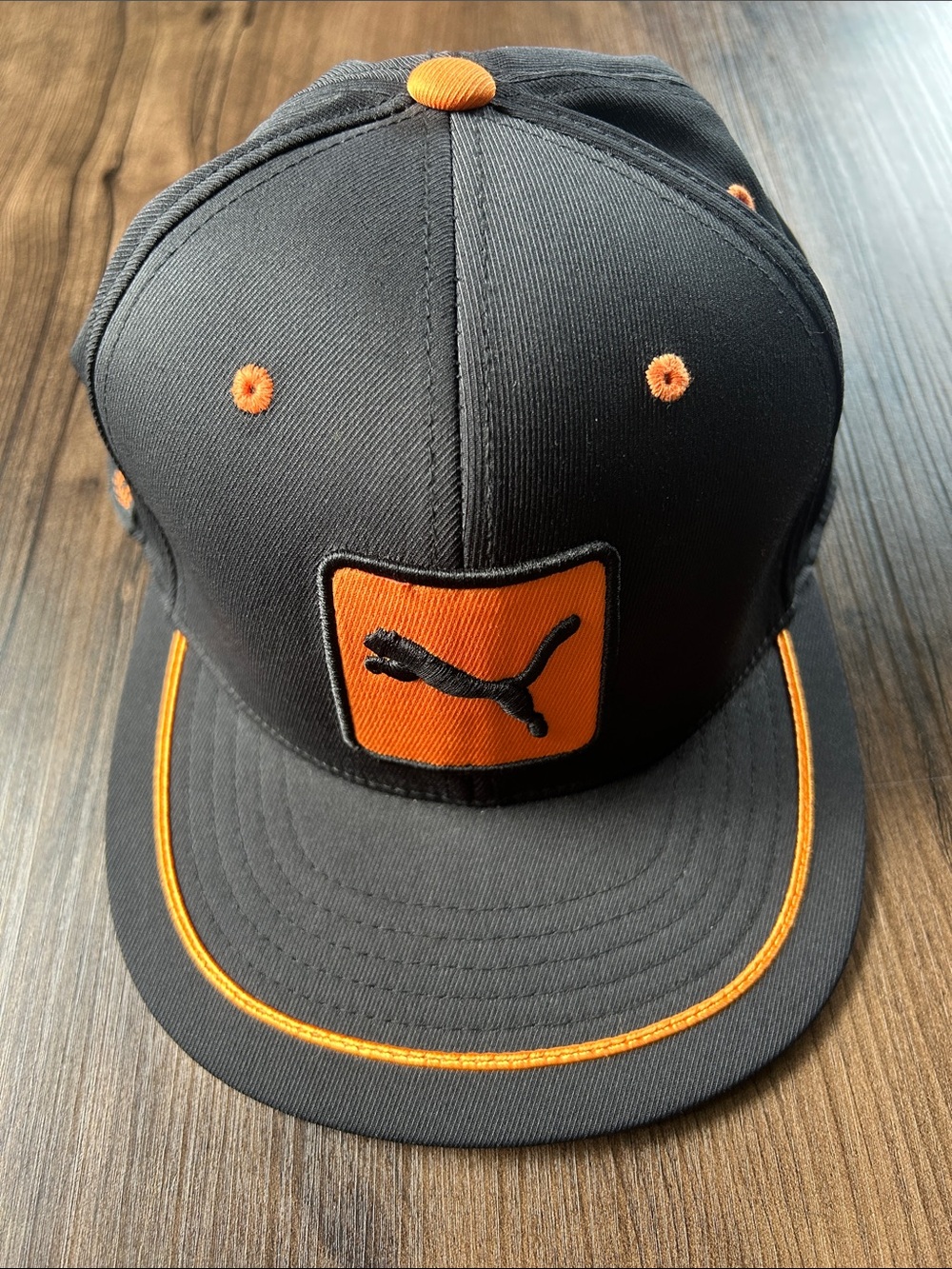 Puma Men’s Black Snapback Cap with Orange Trim